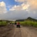 A group of people riding on ATVs along a dusty road in Basseterre, Saint Kitts and Nevis